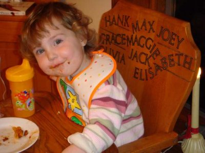 elisabeth enjoys sitting in a very special chair- the last grandbaby to sit in it!