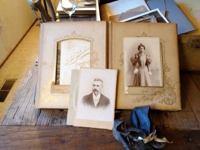 Suitcase contents. A decaying album full of cabinet cards. Unfortunately, the album itself was too far gone to save.