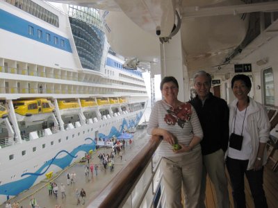 Patti, Gary, Diane on Promenade Deck, docked next to Aida.