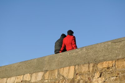 Taking a break on the pier wall