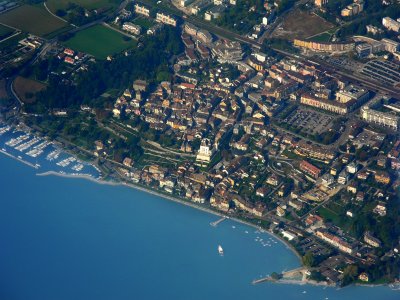 A bird's eye view of the little town and its castle by the lake 