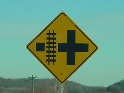yellow railroad  crossing sign