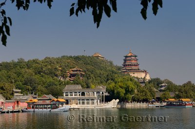 Marble Boat among other ferries on Kunming Lake with Buddhist Fragrance Pavilion on Longevity Hill Summer Palace Beijing
