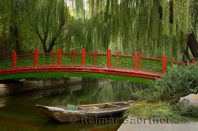 Old bridge over Changpu river with boat and willow trees in Beijing China