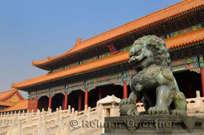 Powerful bronze male lion at the Gate of Supreme Harmony in the Forbidden City Beijing China