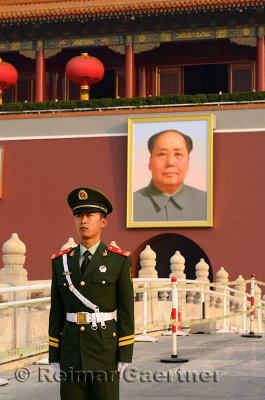 Peoples Armed Police guard with portrait of Mao Zedong at Tiananmen Gate of Heavenly Peace Beijing China