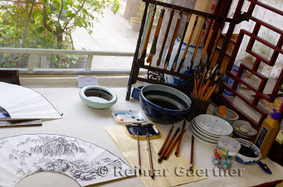 Brushes and ink in a private studio of a professional Chinese painter in a Chichahai area hutong of Beijing