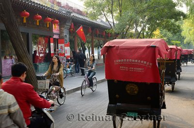 Traffic and line of pedicabs on Qianhai Beiyan street in Shichahai area at Qianhai lake Beijing