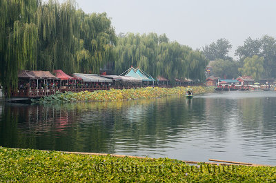 Willow trees and restaurants along Qianhai Lake in the Shichahai area of Beijing China
