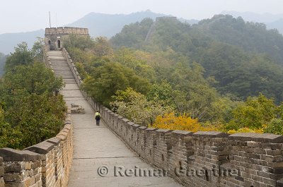Female tourist heading east to tower 8 on the Mutianyu Great Wall of China north of Beijing