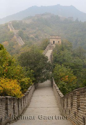 Evening view West towards tower 8 on the Great Wall of China in Fall at Mutianyu north of Beijing China