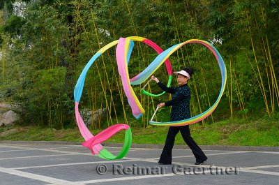 Colorful streamer waving instructor at Zizhuyuan Purple Bamboo Forest Park Beijing