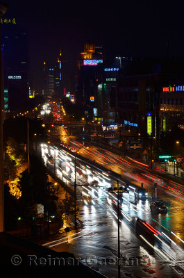 Lights of Qingchung road on a wet night from Wanghu hotel in Hangzhou China