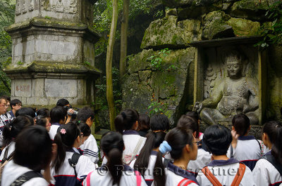Chinese school children at Ligong stone Pagoda at Feilai Feng limestone grottoes Ling Yin temple Hangzhou China
