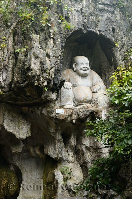 Laughing Buddha scultpure in limestone grotto at Feilai Feng Ling Yin temple Hangzhou China