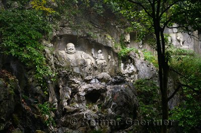Laughing Buddha scultpure at Feilai Feng limestone grottoes at Ling Yin temple Hangzhou China