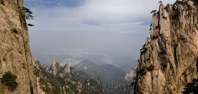 Crack at Beginning to Believe Peak on Huangshan Mountain with villages in the valley China