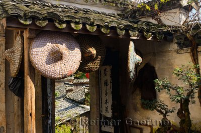 Hats hanging in open courtyard of farmhouse in Hongcun village Anhui Province China