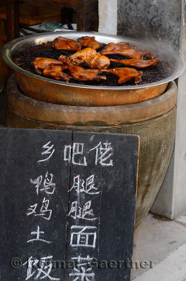 Sign board for street food hot chicken for sale in Hongcun village Anhui Province China