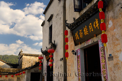 Red lanterns on ancient buildings at Half moon pond in Hongcun village China