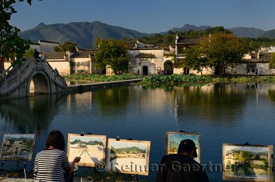 Student painters at South Lake in Hongcun World Heritage Site Anhui Province China