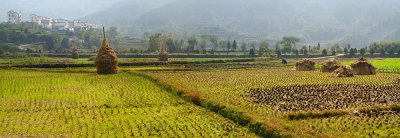 Panorama of Hilltop village and culitvated farm fields and hay stacks at Yanggancun village China