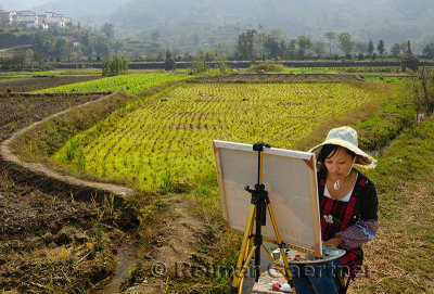 Close up of young female art student painting farmland at Yanggancun hilltop village China