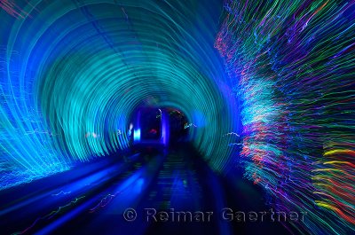 Automated cab car with streaking lights in the Bund Sightseeing Tunnel under the Huangpu River Shanghai China