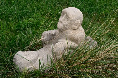 Stone sculpture of monkeys making love in the grass Shanghai Geological Museum China