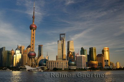 Sunset glow on high rise financial towers and hotels in the Pudong east side of Shanghai China