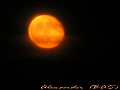 Moon rise over a roof antena