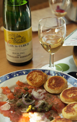 salmon tartar on blinis and Riesling wine.