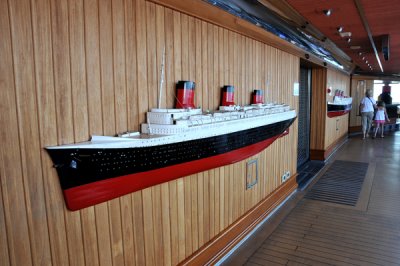 On left, is model of Normandie ship, and on right is Queen Mary ship.
