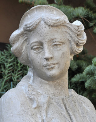Cement statue of young lady