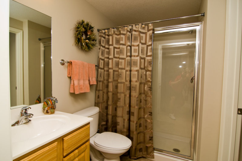 Adjoining bath has large shower w/ easy entry & seating.