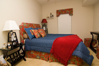 Bedroom has queen bed, 2 closets & TV
