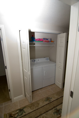 Washer & dryer conveniently located in hall closet.