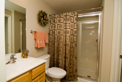 Adjoining bath has large shower w/ easy entry & seating.