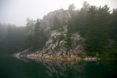 Rock face in morning fog, Covered Portage Cove