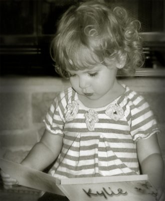 Kylie, reading her book...