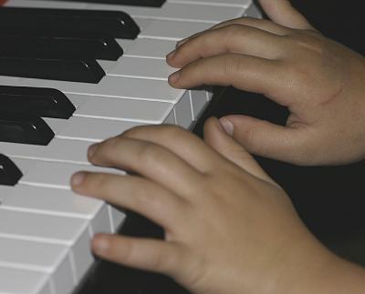Piano and granddaughter's hands