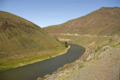 It would be fun to ride the train along here.
