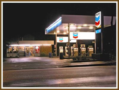 Chevron station at night.