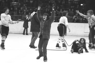 Tug of War on Ice - victorious John Bauslaugh while Diana Johnston lays down on the job 