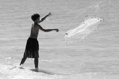 Boy throwing net