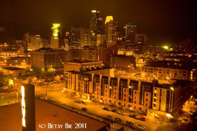Minneapolis skyline through the 9th floor amber glass. Guthrie theater.
