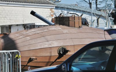 Possibly the oldest submarine in the world,,,dumped in a car park.
