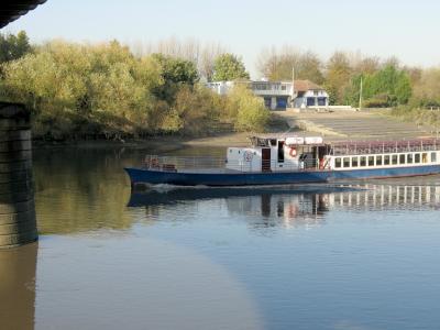 Pleasure boat shooting the bridge.