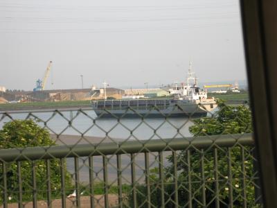 Ship clears bridge, and approaches docks.