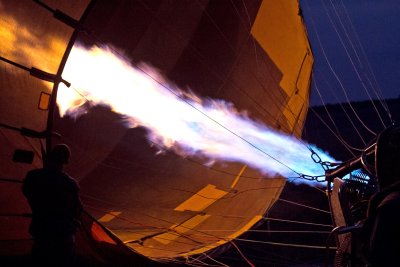 heating the air in the balloon